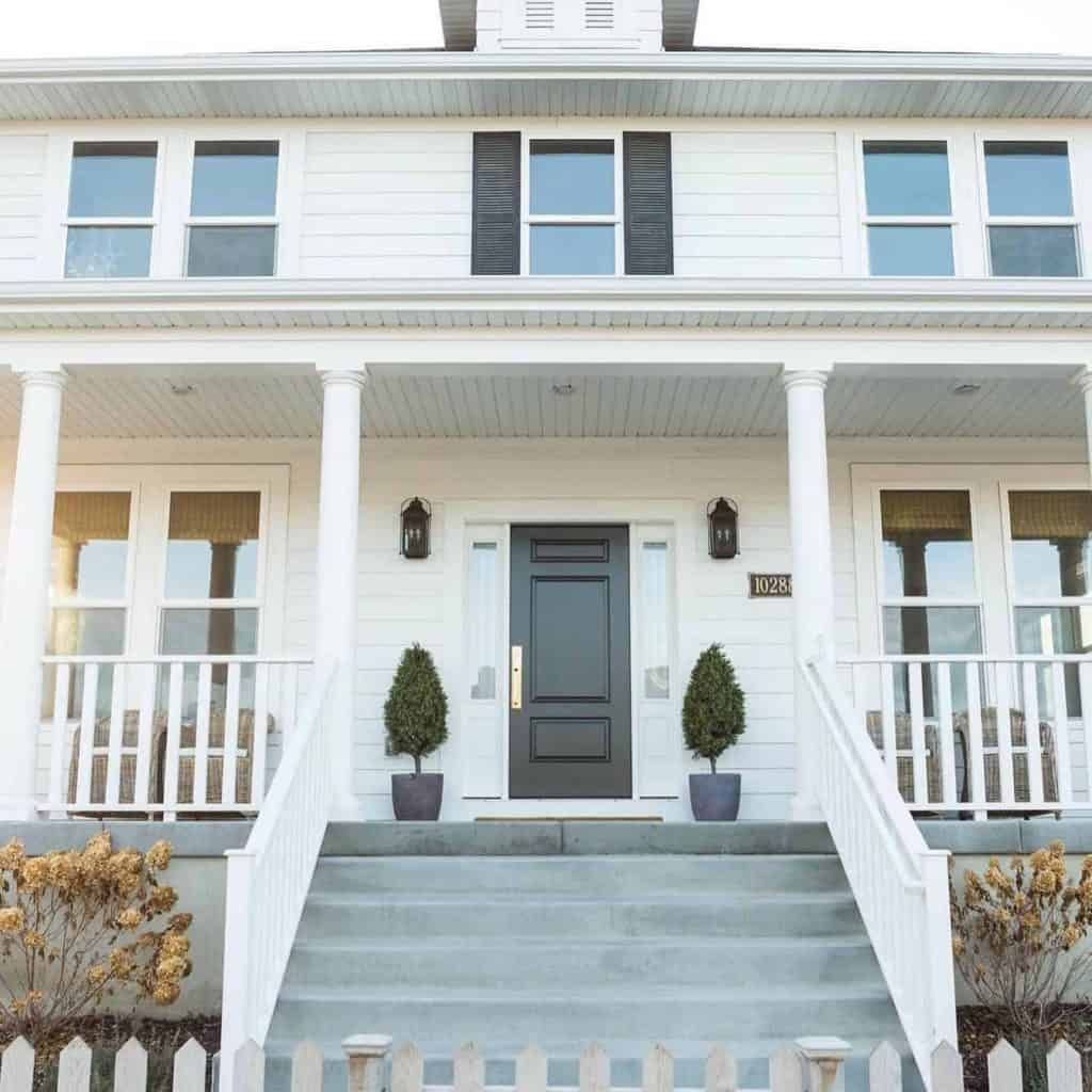 white home with dual pane windows and fiberglass entryway by Therma Tru doors.