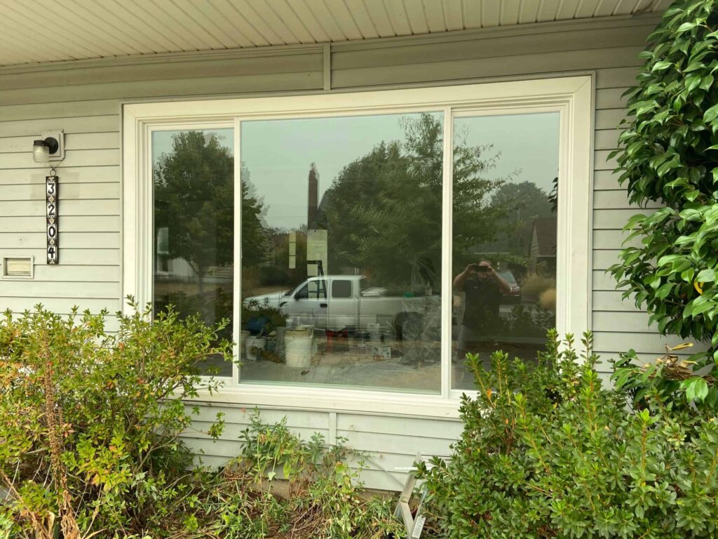 Large energy-efficient picture window installation enhancing curb appeal for a home in Tualatin, OR.