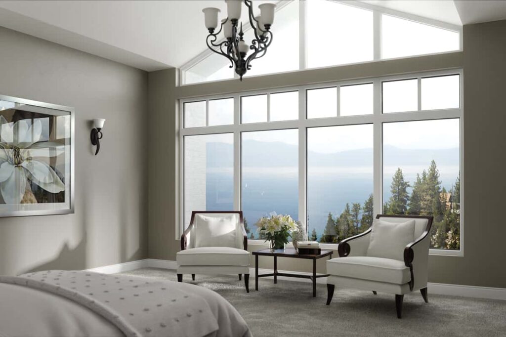 Modern living room with large picture windows and scenic natural views in Tigard, OR.