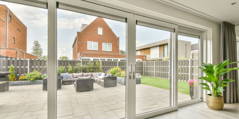 Replacement windows and doors in Portland, OR with a modern patio sliding glass door