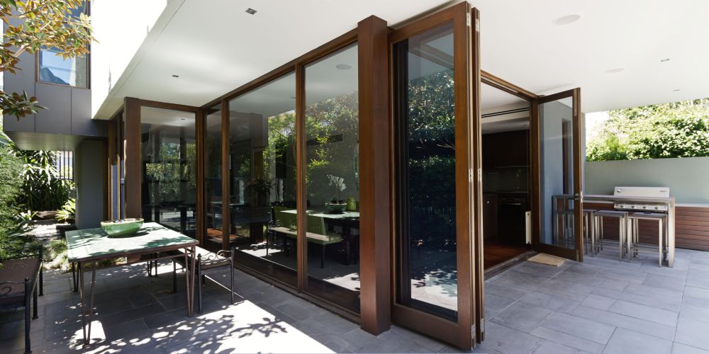 Replacement windows and doors in Tigard, OR with a modern glass patio door
