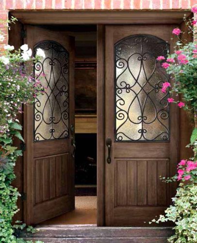 Brown classic craftsman door opening up into a home.